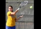 CCLP/TJ MAXWELL - Cove senior Tessa Bliss hits a forehand return earlier in the year. Dawg Tennis improved to 17-5 on the season with a 3-1 weekend.