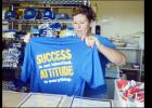 CCLP/LYNETTE SOWELL - The Quarterback Club shirts with this year’s slogan “Success is not inherited – Attitude is Everything” are on sale now at home game concession stands and at the weekly Quarterback Club meetings on Wednesday at noon at Lil Tex Restaurant.