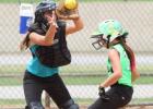 Cove Chaos’ Hallie Kessinger scores as Rockdale Blasters catcher Payton Miller awaits the throw during their game Tuesday in the 2014 TTA Girls 12U State Tournament.