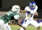 CCLP/TJ MAXWELL -- Copperas Cove junior running back Kylan Herrera stiff arms Ellison defender Isaiah Ivey during the first half of last Friday’s win in Killeen. Herrera and the Dawgs will face off with the Midway Panthers tonight.