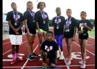 CCLP File Photo - The Centex Pacesetters pose with their medals during practice at Salado Junior High. The qualifying athletes are, left-to-right, Reginald Mouton, Brianna Washington, Zoe Pearson, Michaela Mouton, Katelyn Mouton, Abigail Mouton, Jaylen Watson (kneeling) and Amber Boyd (not pictured).