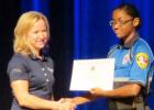 CCLP/BRITTANY FHOLER - Mekayla Tate accepts her award from city manager Andrea Gardner at the Law Enforcement Explorer Program Class of 2016 graduation held in Lea Ledger Auditorium Friday evening.
