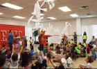 CCLP/PAMELA GRANT - Taylor Griswold, owner of Epic Entertainment, and Kazoo fired toilet paper into the audience as part of their show at the library’s Summer Reading Program.
