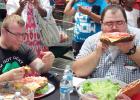 CCLP/CHUCK TAYLOR - Contestants prepare to eat as much as they can of a three-pound burger at H-E-B’s burger-eating contest on Saturday afternoon.