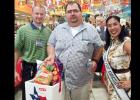 CCLP/CHUCK TAYLOR - Darren Blair of Copperas Cove emerged victorious among the four customers competing in the burger-eating contest on Saturday at Copperas Cove H-E-B Plus!.