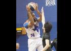 CCLP/DAVID MORRIS - Terence Dill of the Texas Sky Riders ABA basketball team hauls in a rebound against the Shizuoka Gymrats Friday at Camp Triumph in Copperas Cove.