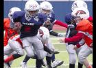 CCLP/TJ MAXWELL - Texans running back Josiah Wilson splits some Broncos defenders in the fourth quater of their 22-12 win in the Copperas Cove Youth Football League Division I championship held Saturday at Bulldawg Stadium. Wilson scored on touchdown runs of 68, two and six yards.