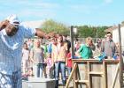 CCLP/BRITTANY FHOLER - Kids lined up to throw water balloons at Michael Anderson, Campus Director of Cove Charter Academy, at the annual Fall Extravaganza held Friday afternoon.