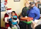 CCLP/LYNETTE SOWELL - On Thursday, the Copperas Cove Soup Kitchen was the setting of a visit from Santa Claus along with a gift distribution to local children in need. More than 60 children were given gifts this year via the gift drive headed up by soup kitchen director, Patrick Richardson.