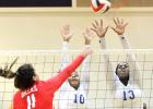 CCLP/TJ MAXWELL-  Copperas Cove seniors Kiarrah Carlisle (10) and Chyanne Chapman attempts a block against Frederericksburg during their Bastrop Tournament Gold bracket match on Saturday. The Lady Dawgs finished the tournament 7-1.