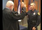CCLP/LYNETTE SOWELL - Eddie Wilson takes the oath of office as he is sworn in as the chief of police Thursday morning.