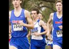 CCLP/TJ MAXWELL - Cove senior William “Chase” Thomas, center, chases after Midway’s Ryan Day and Peter Ferretter, right, during the District 8-6A Cross Country Meet in Waco. Thomas finished fifth to qualify individually and lead his team a third-place finish.