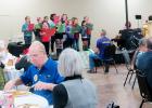 CCLP/BRITTANY FHOLER - Senior citizens of Copperas Cove eat and enjoy entertainment by the Sunrise Singers from Williams-Ledger Elementary School at the annual Christmas senior dinner hosted by the Copperas Cove Exchange Club at the Copperas Cove Civic Center Sunday afternoon.