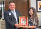 CCLP/BRITTANY FHOLER - CCISD Superintendent Dr. Joe Burns presents Alyssa Walker, a 7th grader at S.C. Lee who won 3rd place in the CCISD Holiday Card contest, with her framed card.