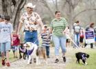 FILE PHOTO - Walkers make their way around the track of the sculpture garden during the inaugural Bark For Life, held in Lampasas. Area dogs and their owners can give the same support by attending Bark For Life in Lampasas on Saturday, an event held by Relay For Life Lampasas-Copperas Cove.