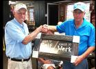 CCLP/TJ MAXWELL - Buck Wilkins, right, is presented with the Ledger Furniture donated golf plaque “Born to Golf/Forced to Work’ by Cove Bass Club secretary Jack Johnson