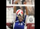 Cove senior Chyanne Chapman yells out as she pounds a block to the floor during the win.