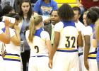 CCLP/TJ MAXWELL - Cove head coach Eldridge McAdams talks to his team in a time out during the Lady Dawgs’ 49-25 win over the Harker Heights Lady Knights.