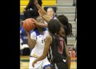 CCLP/TJ MAXWELL - Cove senior Chyanne Chapman draws a foul on a putback attempt in the second half of the Lady Dawgs’ 49-25 win over the Harker Heights Lady Knights Tuesday at Bulldawg Stadium. Chapman had a double-double with 10 points and 14 rebounds to help lead the Lady Dawgs to victory.