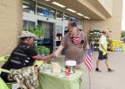 CCLP/DAVID J. HARDIN  A shopper makes a donation to the Disabled American Veterans Chapter 74 during the Forget-Me-Not drive held Saturday at Walmart. 