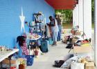 CCLP/LYNETTE SOWELL Customers check out the variety of items at a storage unit sale, held by Armadillo Properties. The real estate management company is donating the sales from the two-day event to Cove House Emergency Homeless Shelter. 