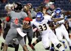 Cove defensive lineman Martinez Rogers pressures Heights' quarterback Robert Gray in the first half of action