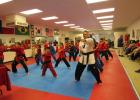 CCLP/BRITTANY FHOLER Copperas Cove firefighter Stephen Clendenen joins his Self Defense America classmates in a demonstration at the ceremony held Friday evening at Self Defense America located in the Cove Terrace Shopping Center. 