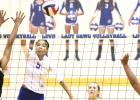 CCLP/TJ MAXWELL -- Copperas Cove senior Raeven Dickerson hits for a kill past Harker Heights senior Kennedi Foster during the Lady Dawgs 3-1 (20-25, 25-7, 25-12, 25-16) win over the Lady Knights Tuesday in Cove. Dickerson shared team-high kill honors with junior Chyanne Chapman and Foster led the match with 11 kills for the Lady Knights.