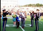 CCISD/Courtesy Photo - The Copperas Cove High School JROTC Saber Team uses its sabers to form an arch under which the newly crowned homecoming queen and king, Skye Richard and Juston Case, pass. The saber arch is a military tradition typically used to introduce a new couple to the community.