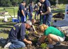 CCLP/FILE PHOTO - JROTC and KCCB members complete a beautification project at the entrance to the Hills of Cove Golf Course on May 7. KCCB has finished the Great American Cleanup for 2016. Its next community event is October’s EcoHarvest.