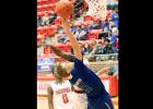 CCLP/TJ MAXWELL - Copperas Cove junior Jyhlil Rice attempts a shot with Cedar Hill 6-feet-5 senior Daniel Odufuwa defending. Rice scored 12 points, including eight points in the second half.