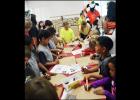 CCLP/LYNETTE SOWELL - Kids get to decorate their own cardboard shields at Wednesday morning’s summer reading program kickoff held at the Copperas Cove Public Library.