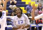 CCLP/TJ MAXWELL - Lady Dawgs, from left, Kiarraj Carlisle (10), Brinna Acker, Chyanne Chapman and Aidan Chace celebrate a Chapman block that ended their five-set match against Liberty Hill on Tuesday. The Lady Dawgs won (26-28, 21-25, 25-17, 25-19, 15-9).