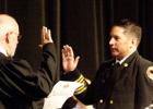 Michael Neujahr receives his oath of office from Judge Bill Price during Fridays swearing in ceremony.