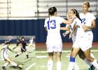 CCLP/TJ MAXWELL - INSET: Copperas Cove junior Nicole Evans makes a cross to sophomore Mariah Ruiz during the first half of the Lady Dawgs’ playoff-clinching 1-0 win over Killeen Friday night at Bulldawg Stadium. ABOVE: Freshman Haven Stevenson celebrates with teammates Kailey Walker (13) and senior Jordan Campbell after she scored with a header on a cross from Evans in the 37th minute.