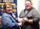 Morning Exchange Club President Mary Derrick presents Joey Ellis of Aware Central Texas with a check for $500 during their Wednesday meeting.