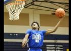 Courtesy photo - Cove sophomore Quinton Ford competes in the dunk contest during the annual Meet the Dawgs event
