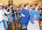 File Photo - The crowd kicks up their heels at last year’s Wild West Night held by the Fort Hood Spouses’ Club. This year’s event is set for March 3 and will help raise funds to benefit local charities and provide student scholarships.