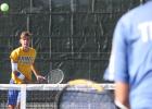 CCLP/TJ MAXWELL - Copperas Cove’s Trystan Jackson watches his serve during his doubles’ match with Nick Motley against Lampasas on Tuesday. Jackson and Motley won the match 6-2, 6-4 and also picked up singles wins for the team.