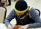 CCLP/PAMELA GRANT - Wendy Marsh works on tooling leather at the medieval workshop hosted by the SCA at the Copperas Cove Public Library. Here she works on finishing off her greaves which will be worn when she participates in rapier fighting.