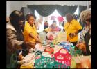 CCLP/LYNETTE SOWELL - Volunteers from the Women’s Army Corps Veterans Association sort through baby items as they make baskets for mothers-to-be at the Hope Pregnancy Center.