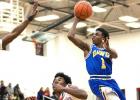 Copperas Cove senior Jordan Woodberry shoot over a pair of Harker Heights defenders during their 78-62 upset of the No. 7 Knights Friday in Harker Heights. Cove returns to action tonight with a home contest against the Shoemaker Grey Wolves.