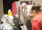 Supporters of Cove House Homeless Shelter browse through more than a dozen
raffle items during the fourth annual fundraising banquet.