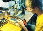 Cove FFA Chapter President Daniel West puts the final touches on his carved leather gun belt to enter in the home economics contest at the Coryell County Youth Fair which run Jan. 15-17.