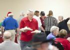 Exchangite Frank Seffrood delivers meals to more than 100 seniors who attended the annual appreciation luncheon.