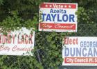 Campaign signs hang on a fence along Veterans Ave. The word “for” on the signs has become a hot topic between the candidates with Lack and Duncan both admitting they inadvertently left off the word.