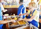 April Fitzgerald serves up eggs at Saturday’s flapjack fundraiser held by the Rotary
Club at Applebees on Saturday.