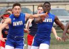 Copperas Cove dual-sport athlete Andrew Leuthner gets the hand off from teammate Justin Joe during 4x100- meter relay as part of the Eagle Relays in March.