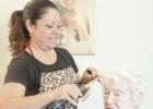 Owner, Maria Oliveras of Maria’s Beauty Salon trims and curls Killeen resident Ann Barnette’s hair. Barnette, 94, has been visiting Maria for regular beautification for the last seven years.