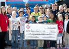 Representatives from the Copperas Cove Boys and Girls Club accept a $1,000 donation from Stripes Convenience Store during the grand opening celebration Friday.